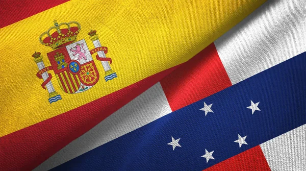 España y las Antillas Holandesas dos banderas tela textil, textura de la tela — Foto de Stock