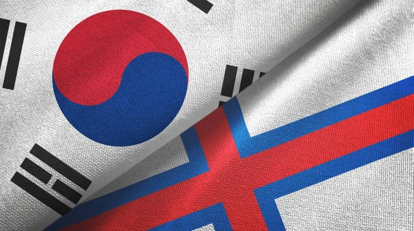Corea del Sur e Islas Feroe dos banderas tela textil, textura de la tela —  Fotos de Stock