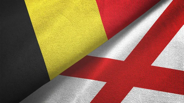 België en Noord-Ierland twee vlaggen textieldoek, textieltextuur — Stockfoto