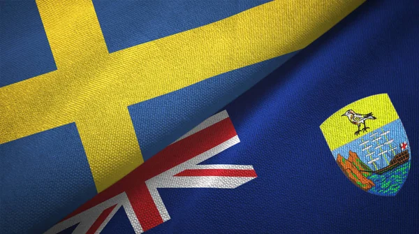 Suécia e Santa Helena duas bandeiras pano têxtil, textura de tecido — Fotografia de Stock