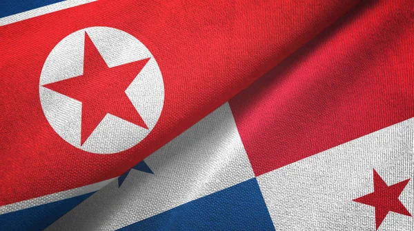 Noord-Korea en Panama twee vlaggen textiel doek, stof textuur — Stockfoto
