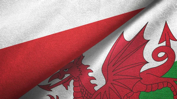 Polónia e País de Gales duas bandeiras pano têxtil, textura de tecido — Fotografia de Stock