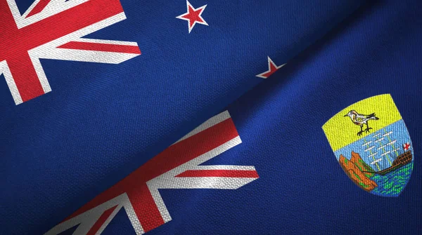 Nya Zeeland och Saint Helena två flaggor textilduk, textur — Stockfoto