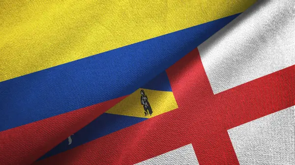 Colombia en Herm twee vlaggen textiel doek, stof textuur — Stockfoto