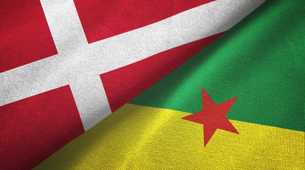 Danmark och Franska Guyana två flaggor textilduk, textur — Stockfoto