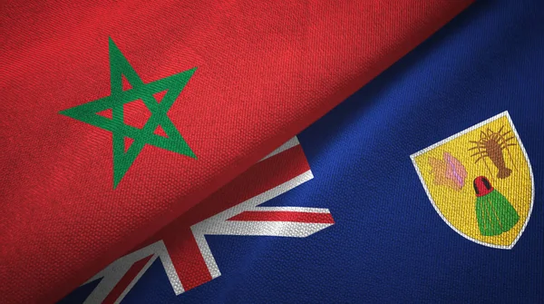 Marokko en Turks- en Caicoseilanden twee vlaggen textiel doek, textiel textuur — Stockfoto