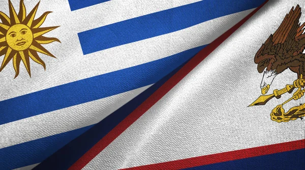 Uruguay y Samoa Americana dos banderas de tela textil, textura de tela —  Fotos de Stock