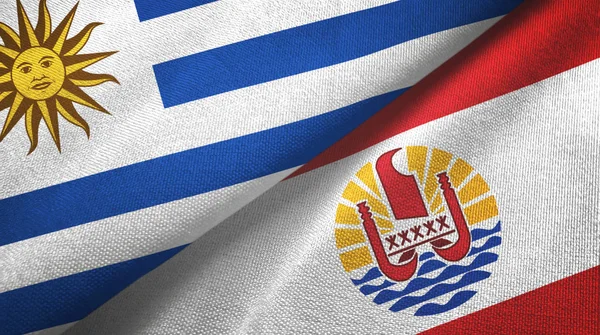 Uruguay y Polinesia Francesa dos banderas tela textil, textura de la tela —  Fotos de Stock