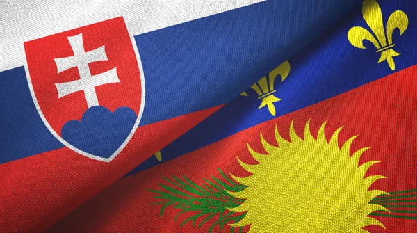 Slovakien och Guadeloupe två flaggor textilduk, textur — Stockfoto