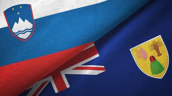 Slovenia e Isole Turks e Caicos due bandiere tessuto, tessitura del tessuto — Foto Stock