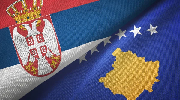 Serbien och Kosovo två flaggor textilduk, tyg struktur — Stockfoto