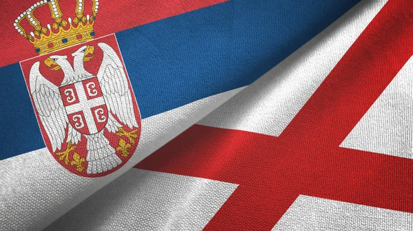 Serbien und Nordirland zwei Flaggen Textiltuch, Textilstruktur — Stockfoto