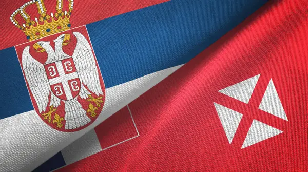 Serbien och Wallis och Futuna två flaggor textilduk, textur — Stockfoto