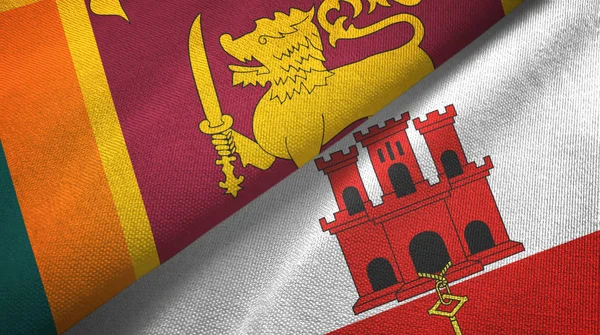 Sri Lanka y Gibraltar dos banderas tela textil, textura de la tela — Foto de Stock