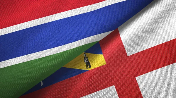 Gambia en Herm twee vlaggen textiel doek, stof textuur — Stockfoto