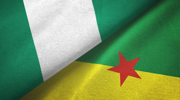 Nigeria e Guiana francese due bandiere tessuto, tessitura tessuto — Foto Stock