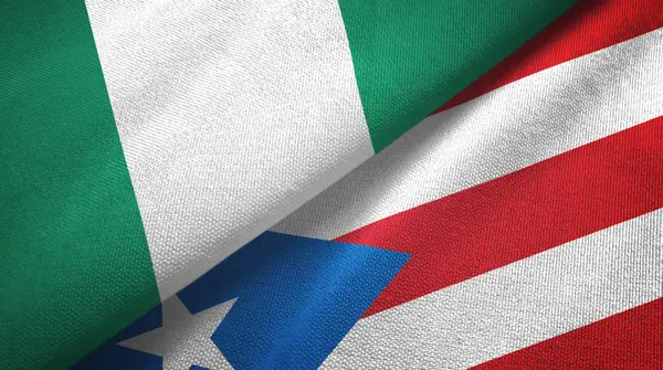 Nigeria en Puerto Rico twee vlaggen textiel doek, stof textuur — Stockfoto