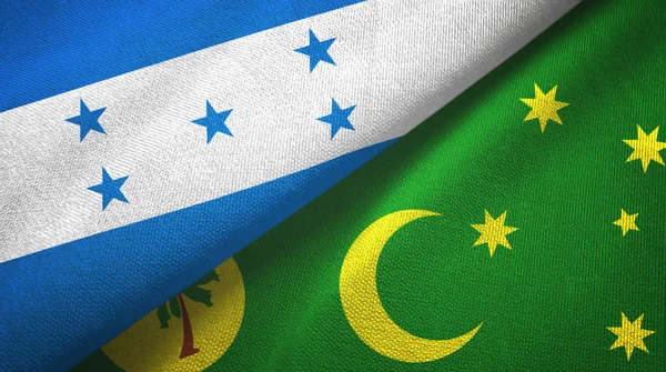 Honduras en Cocos Keeling eilanden twee vlaggen textiel doek, stof textuur — Stockfoto