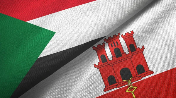 Sudan e Gibilterra due bandiere tessuto, tessitura tessuto — Foto Stock