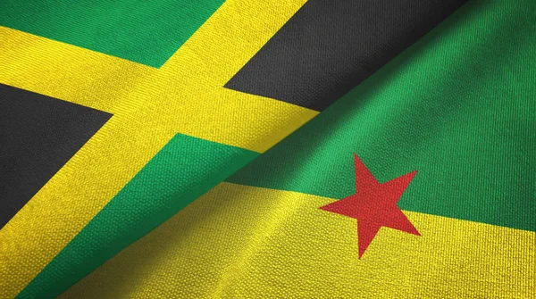 Jamaica és Francia Guyana két zászló textilszövet, szövet textúra — Stock Fotó