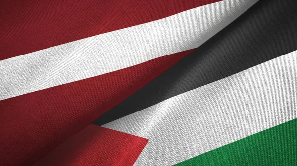 Letonya ve Filistin 'de iki bayrak, tekstil kumaş, kumaş dokusu — Stok fotoğraf