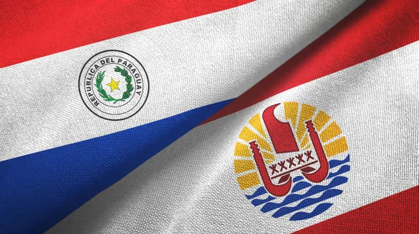Парагвай и Французская Полинезия два флага текстильная ткань, текстура ткани — стоковое фото