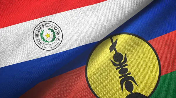 Paraguai e Nova Caledônia duas bandeiras de pano têxtil, textura de tecido — Fotografia de Stock