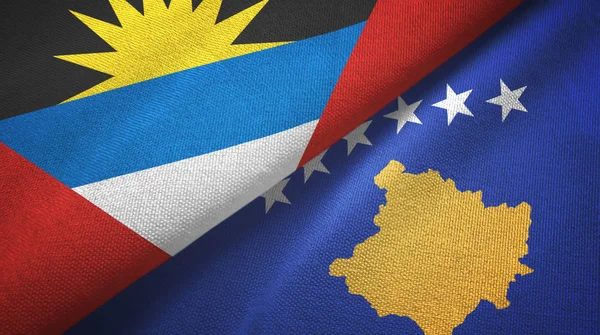 Antigua y Barbuda y Kosovo dos banderas tela textil, textura de la tela — Foto de Stock