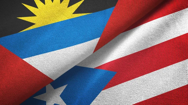 Antigua en Barbuda en Puerto Rico twee vlaggen textiel doek, stof textuur — Stockfoto
