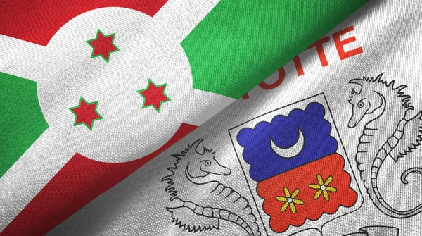 Burundi en Mayotte twee vlaggen textiel doek, stof textuur — Stockfoto