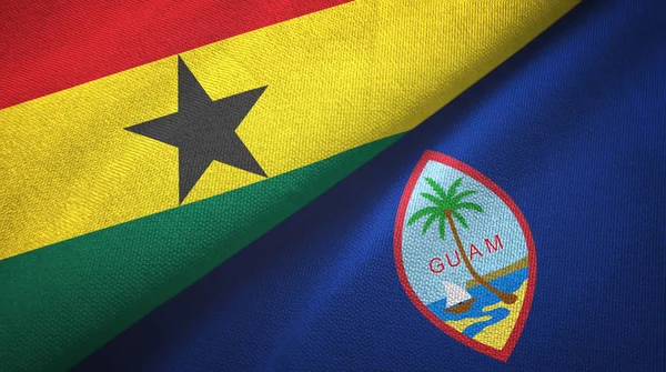 Ghana och Guam två flaggor textil duk, textur — Stockfoto
