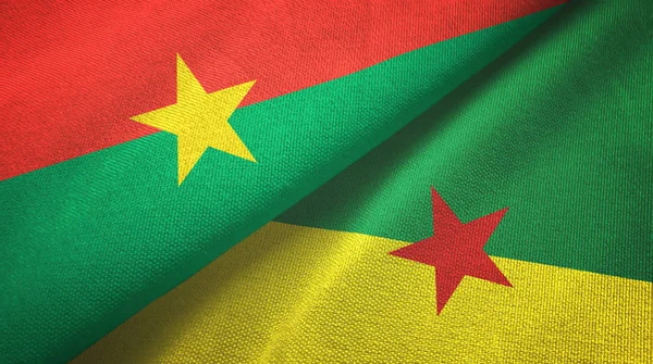 Burkina Faso und Französisch Guiana zwei Flaggen Textilstoff, Textur — Stockfoto