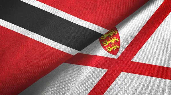 Trinidad en Tobago en Jersey twee vlaggen textiel doek, stof textuur — Stockfoto