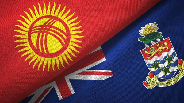 Kirguistán e Islas Caimán dos banderas tela textil, textura de la tela — Foto de Stock