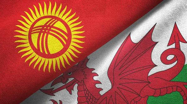 Kirguistán y Gales dos banderas tela textil, textura de la tela — Foto de Stock