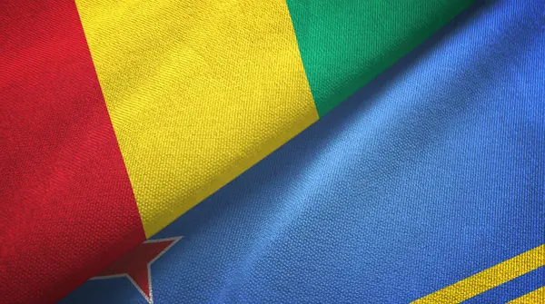 Γουινέα και Αρούμπα δύο σημαίες υφάσματος, υφάσματος υφάσματος — Φωτογραφία Αρχείου