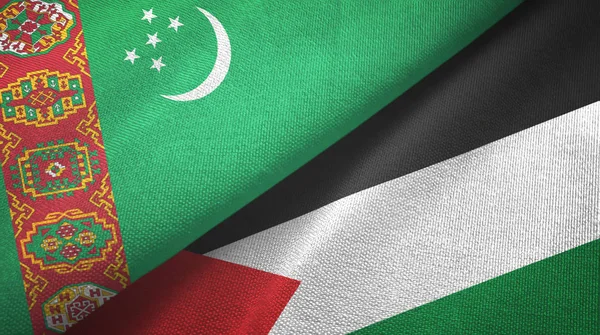 Turkmenistán y Palestina dos banderas tela textil, textura de la tela — Foto de Stock