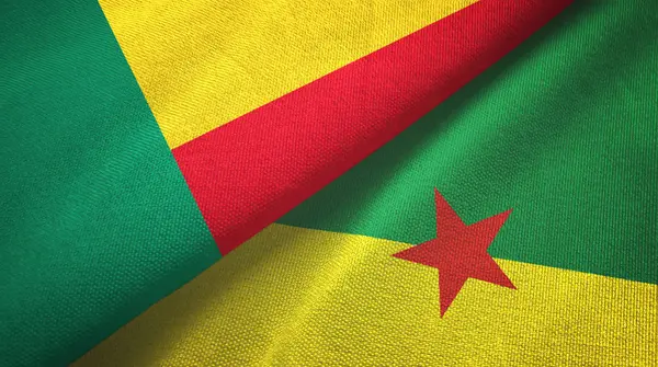 Benin und Französisch Guiana zwei Flaggen Textiltuch, Textur — Stockfoto