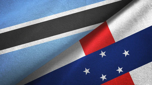 Botswana y las Antillas Holandesas dos banderas tela textil, textura de la tela — Foto de Stock