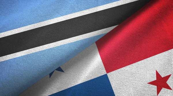 Botswana en Panama twee vlaggen textiel doek, stof textuur — Stockfoto