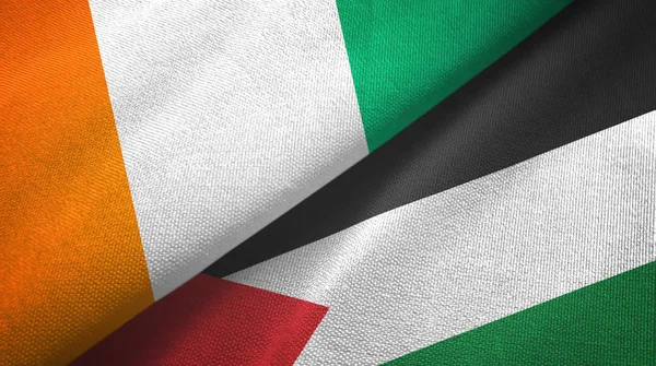Ivory Coast Cote d'Ivoire and Palestine two flags textile cloth, fabric texture — Stock Photo, Image