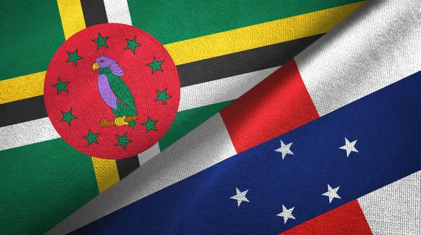 Dominica en Nederlandse Antillen twee vlaggen textiel doek, textiel textuur — Stockfoto
