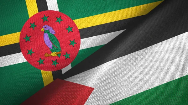 Dominica en Palestina twee vlaggen textiel doek, stof textuur — Stockfoto