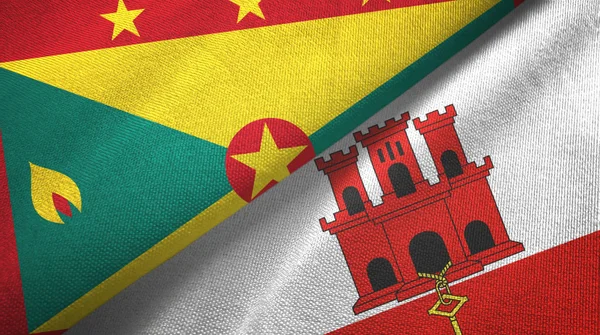 Grenada en Gibraltar twee vlaggen textiel doek, stof textuur — Stockfoto