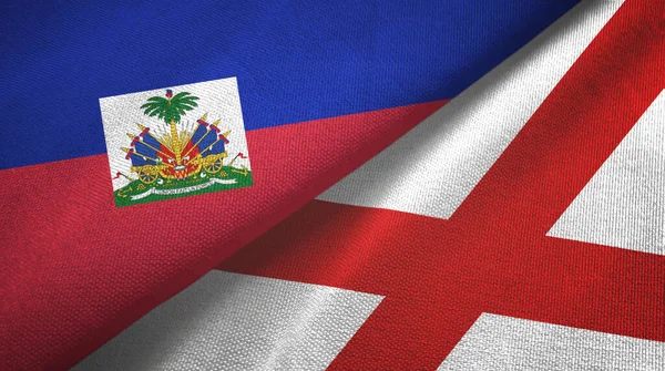 Haiti e Irlanda del Nord due bandiere tessuto, tessitura tessuto — Foto Stock