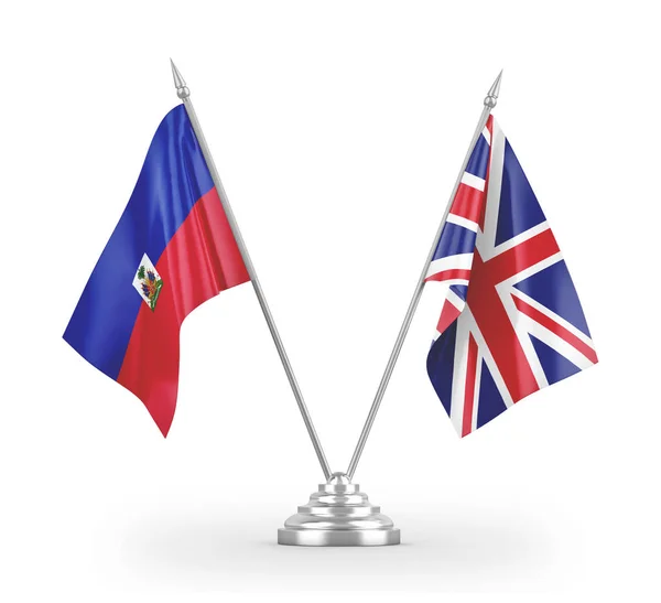 Bandeiras de mesa do Reino Unido e Haiti isoladas em renderização 3D branca — Fotografia de Stock