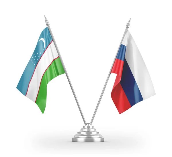 Ρωσία και Ουζμπεκιστάν σημαίες τραπέζι απομονώνονται σε λευκό 3d απόδοση — Φωτογραφία Αρχείου