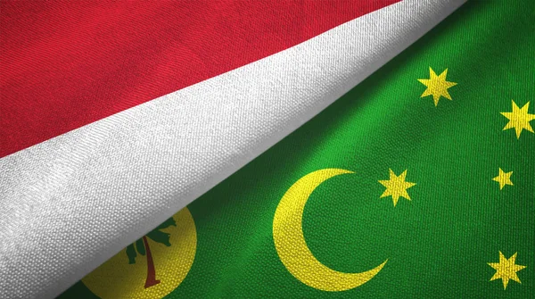 Indonesië en Cocos Keeling Eilanden twee vlaggen textiel doek, stof textuur — Stockfoto