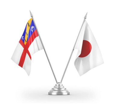 Japonya ve Herm masa bayrakları beyaz 3D görüntüleme üzerinde izole edildi