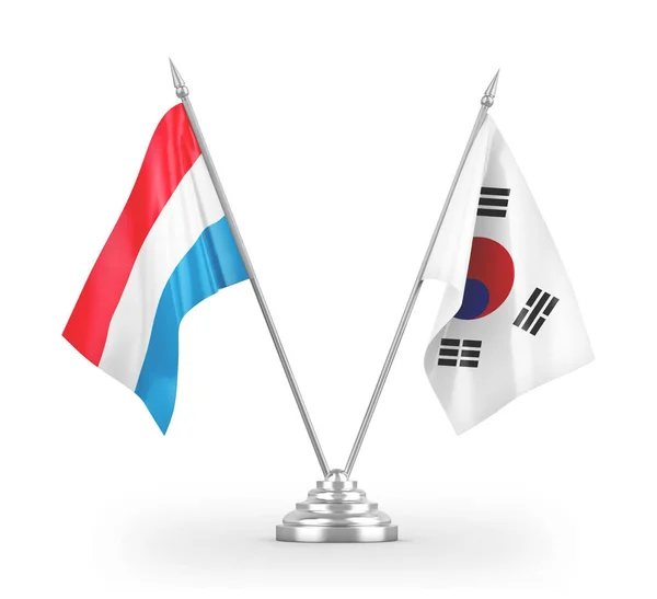 白い3Dレンダリングに隔離された韓国とルクセンブルクのテーブルフラグ — ストック写真
